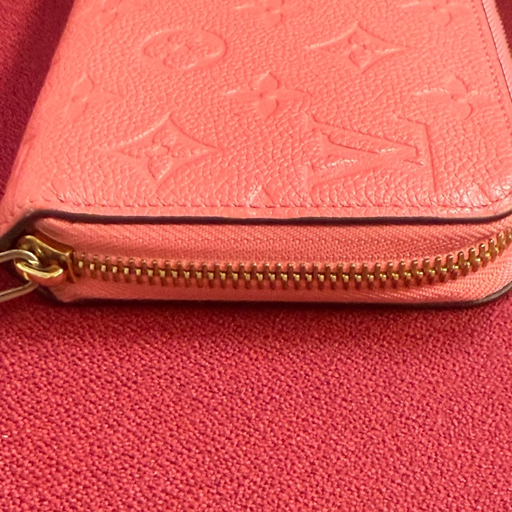 Authenticated Louis Vuitton Pink/Coral Monogram Empreinte Zippy Leather Wallet - Picture 4 of 16